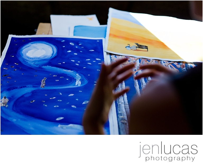 Soyoung Kim uses her hands to explain her work in front of her. 