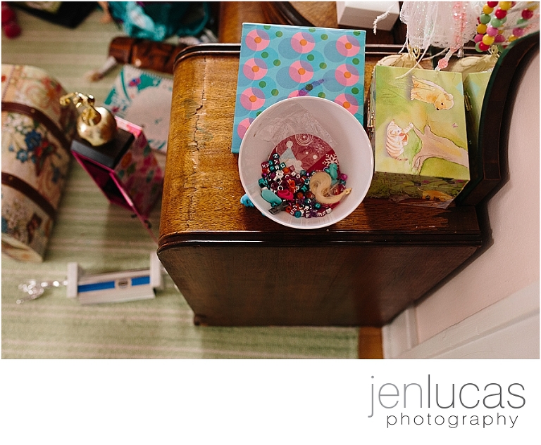 Charms, boxes, trophies--details found on young  girl's dresser. 