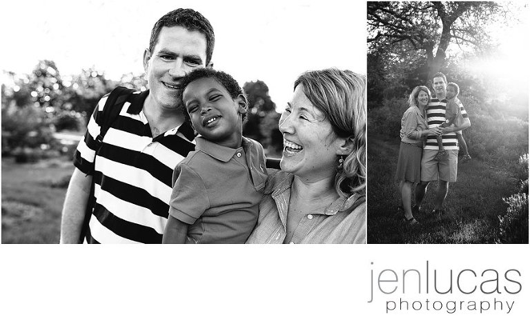 Family of three smile together--camera aware. Black and white.