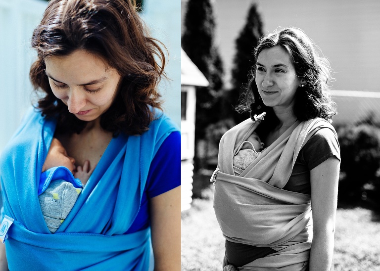 Mom holds sleeping newborn baby in a sling across her chest while she goes on a walk.