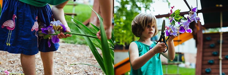 Young girl standing outside cuts a bouquet of flowers.