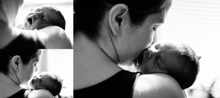Black and white. Mom holds and kisses newborn baby girl.