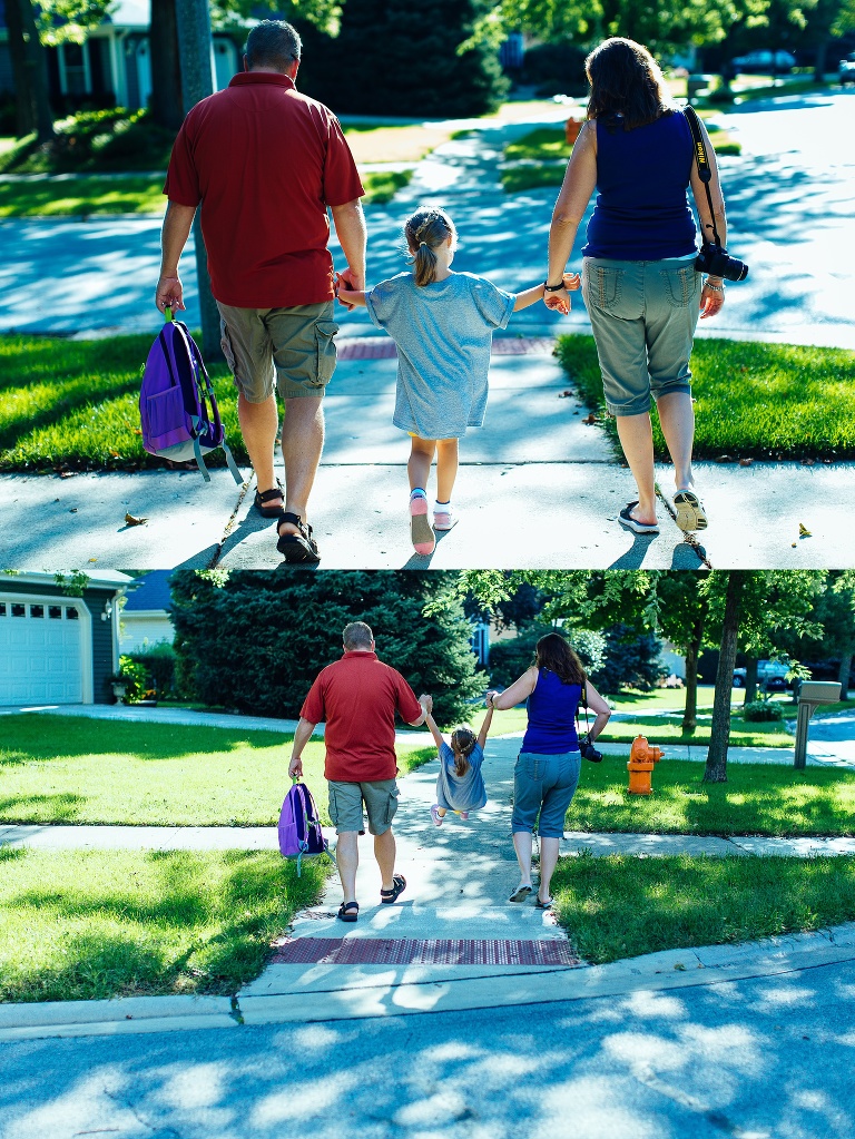 Kindergartener walks between two parents on the way to school