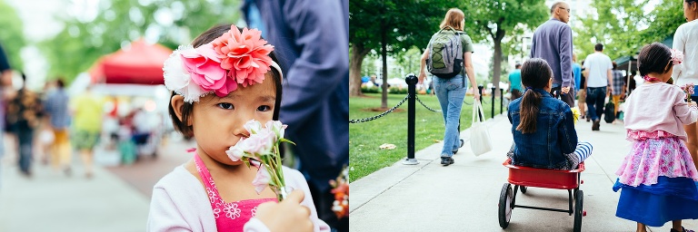 Dad pulls his daughter in a wagon while walking through a farmers market.