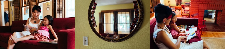 Moms sits on the couch reading a book to her daughter.