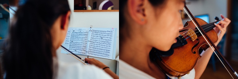 Girl stands playing her violin.