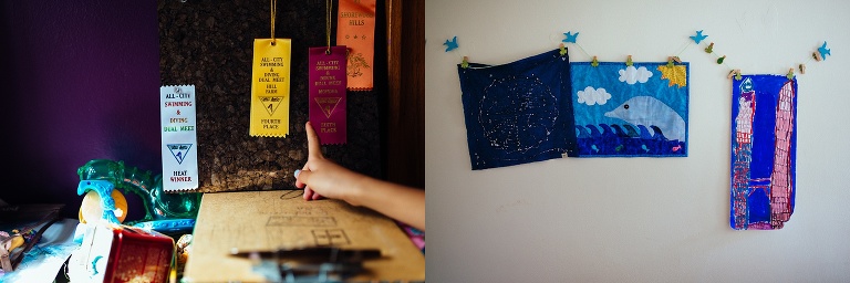 Hand points to ribbons hung on a wall. three handmade quilts hanging on a wall.