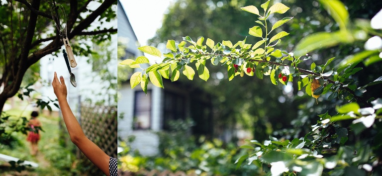 Girl touches a handmade wind chime while walking through the yard to a cherry tree.