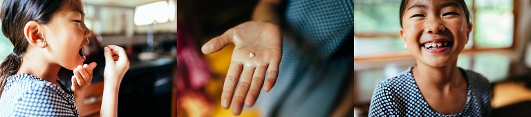 Young girl pulls out a tooth.