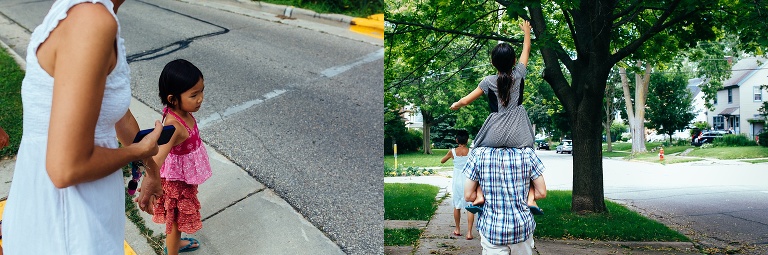 Family walking down the sidewalk. daughter ridding on her dads shoulders.