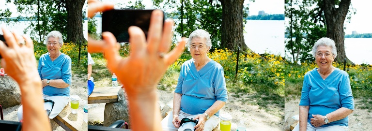 Family takes birthday pictures of 90 year old mother.