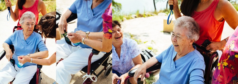 Three sisters laugh with their 90 year old mother in celebration of her birthday.
