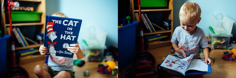 Young boy sitting on the floor reading "the cat in the hat."