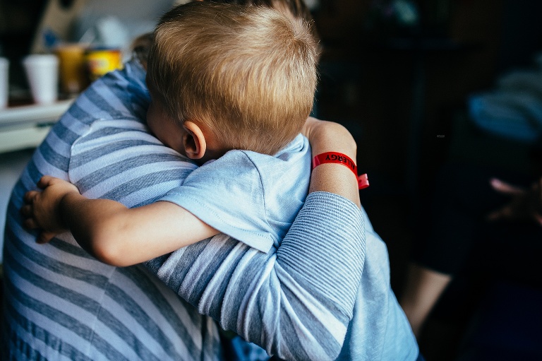 Father giving a hug to his son.