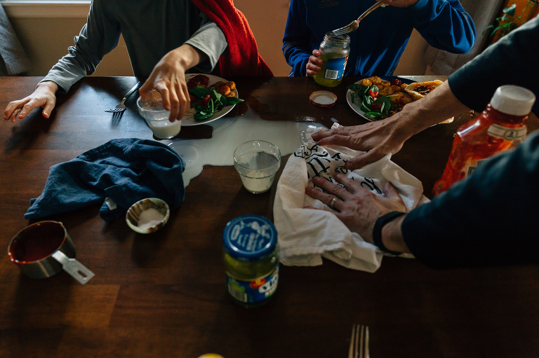 Cleaning up a milk spill at dinner