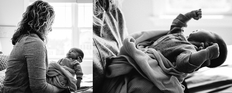 Black and white. Mother holds sleeping newborn baby.