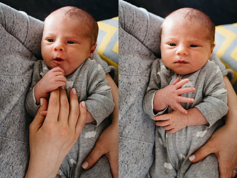 Mother cradles newborn baby in her arms.