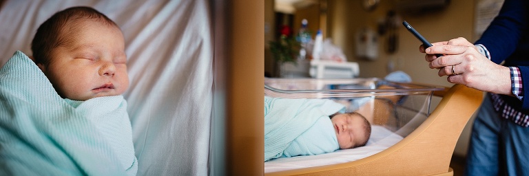 Newborn baby sleeping in hospital crib. Man takes photo of the baby with phone.