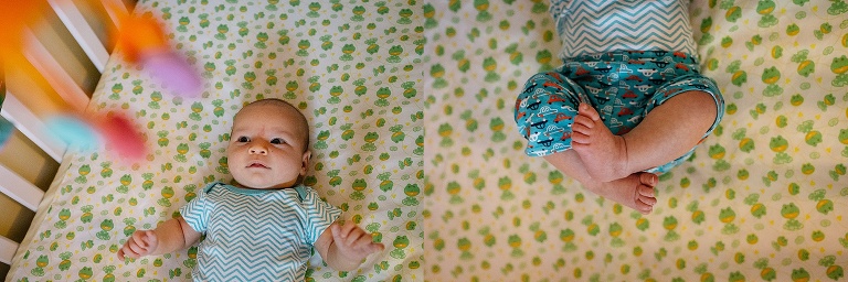 Newborn baby laying on his back in his crib.