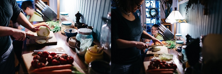 Woman in her kitchen cuts up a onion.