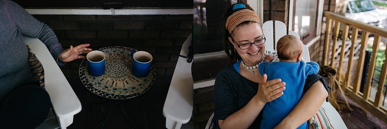 Mothers sit on patio with two cups of coffee. one holding newborn son.