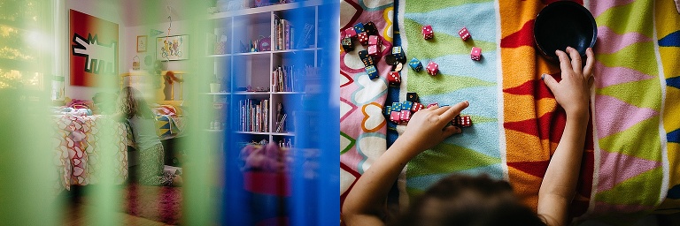 Young girl playing in her colorful room.