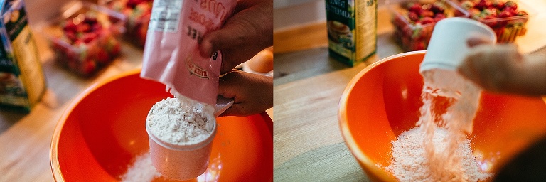 young girl pours flour into a orange mixing bowl in the kitchen.