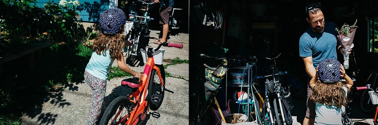 Father helps daughter put her bike away in the garage after a trip to the farmers market.