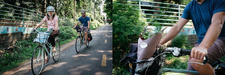 Mother and father bike on a path on their way home from a farmers market.