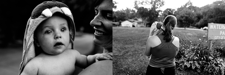 Black and white. Baby wearing kid towel held by mother.