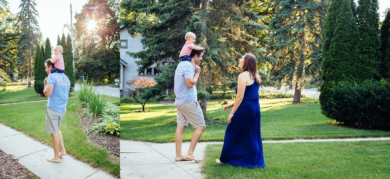 Dad carrying baby on his shoulders mom watching.