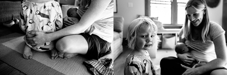 Black and white. Mother sits with young daughter while breastfeeding newborn baby