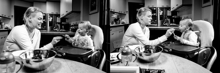 Black and white, Mother helps feed young daughter dinner