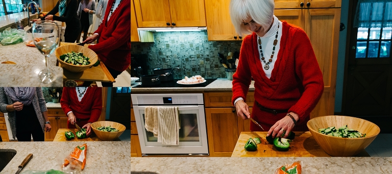 Family makes salad in the kitchen together.