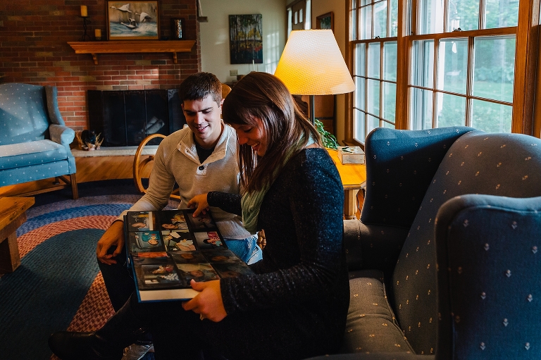 Family looks at old picture books together.
