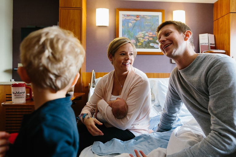 Family spends time together in hospital with new baby boy.