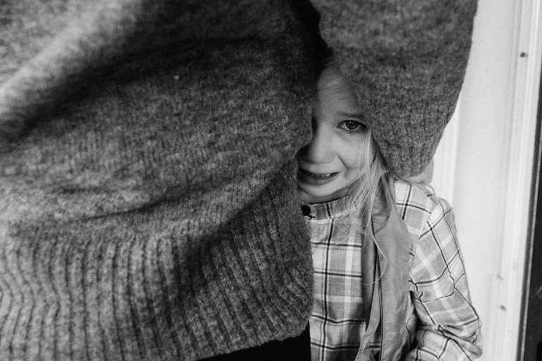 Black and white. mother hugs young daughter