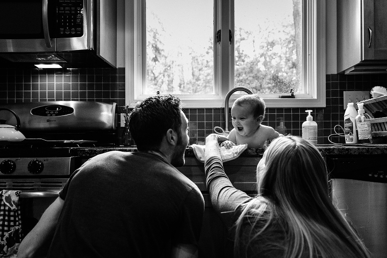 Baby girl has sink bath while playing hide and seek with her parents 