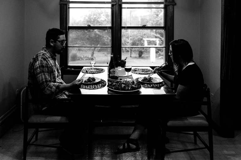 Black and white. Man and woman eating dinner together