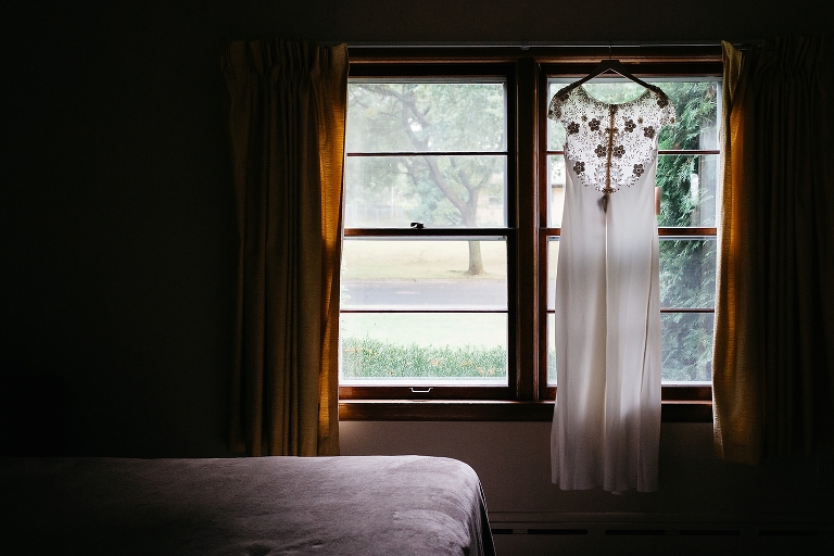 Wedding dress hanging on window