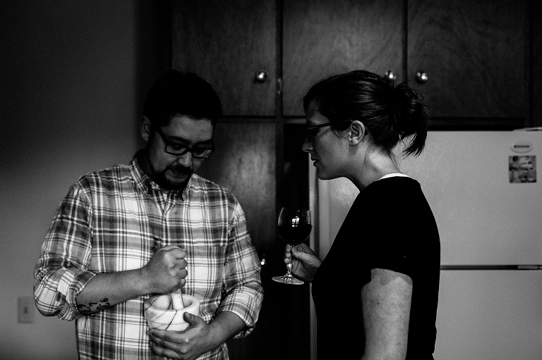 Black and white, Man and woman drinking wine and cooking in kitchen together