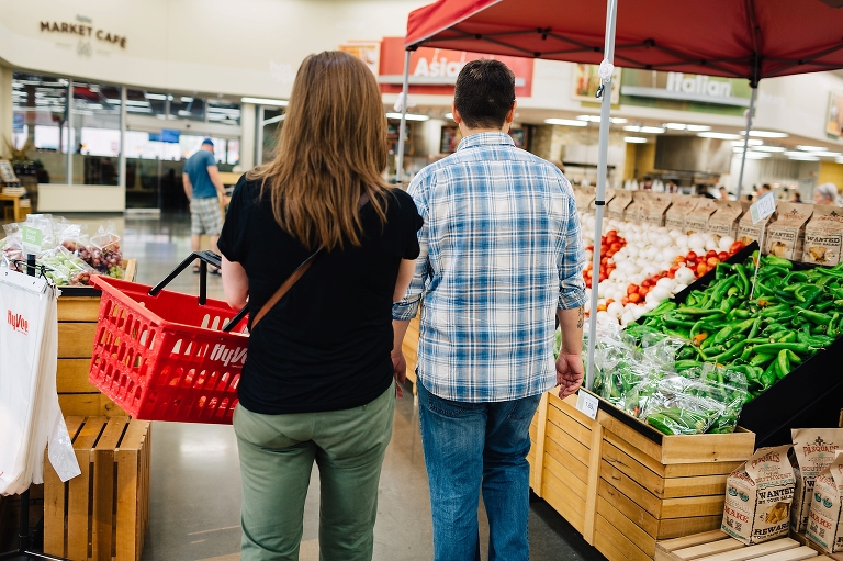 a couple enters a grocery store 