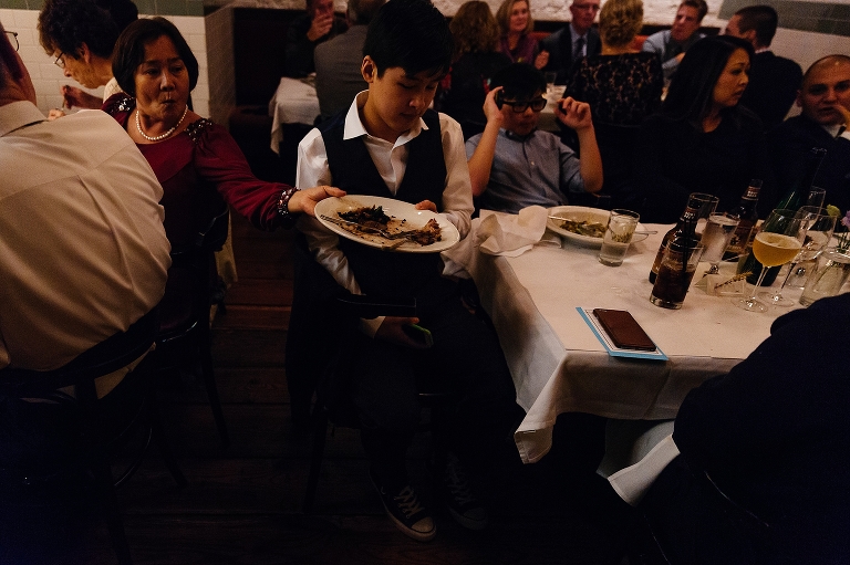 Family passing dinner entrees around