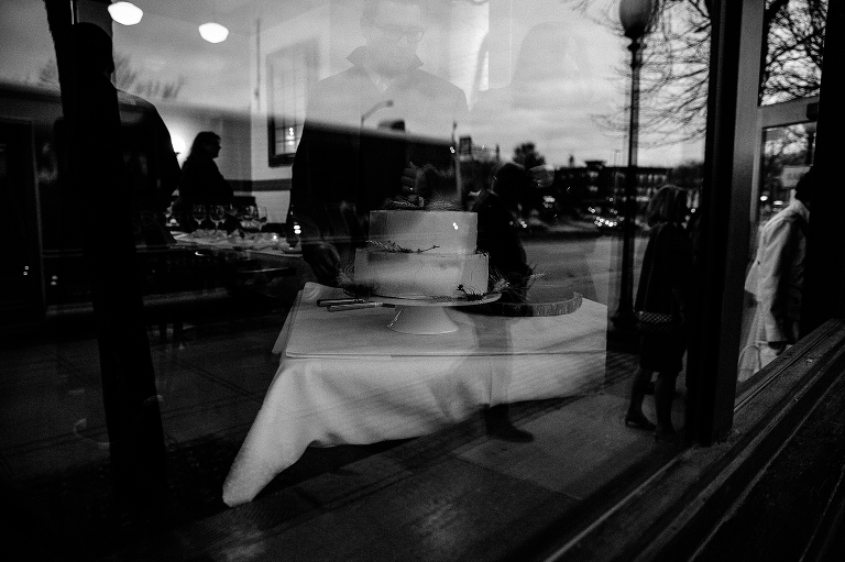 Black and white. Family looks at wedding cake
