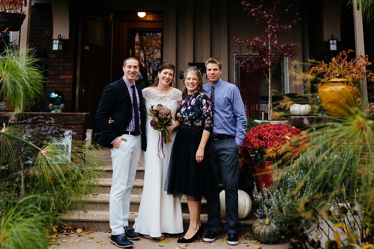 Bride takes photos with her family after the wedding