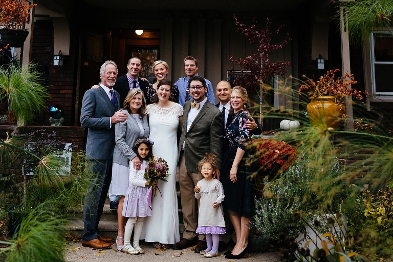 Bride and groom takes photos with the family after the wedding