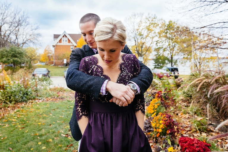 Husband and wife hug at family's wedding