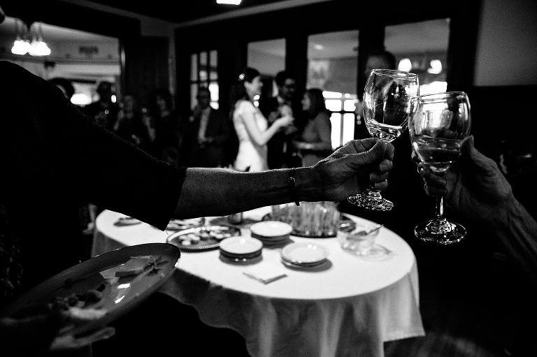Black and white, Family toasts glasses at wedding after party