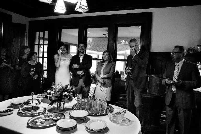 Black and white. Family cries at wedding toast