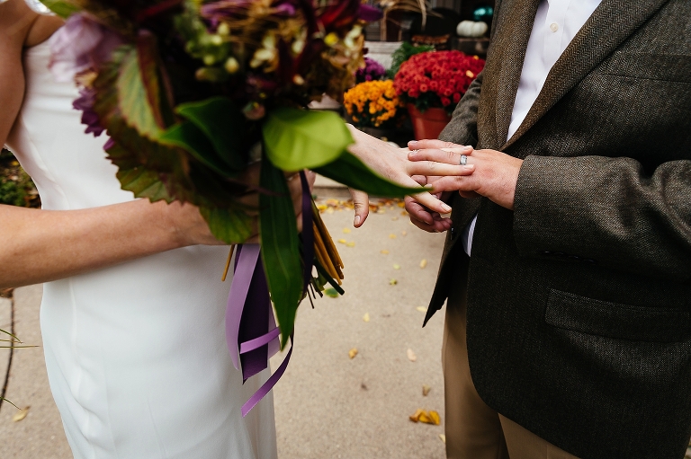 Husband and wife look at each others new rings
